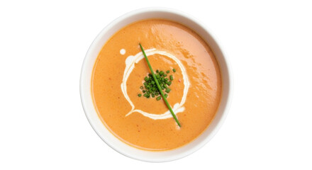 Isolated tomato soup garnished with cream and chives ready to serve, overhead view