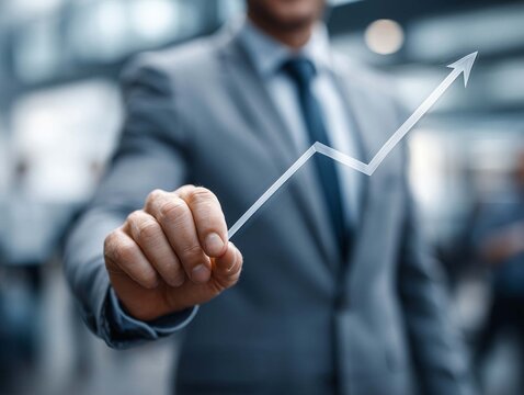 businessman hand drawing a growing graph, business success and growth concept