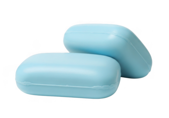 Two light blue bar soaps with rounded edges isolated on transparent background