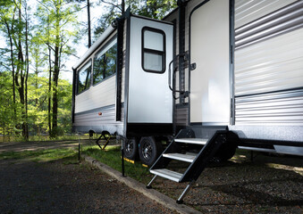 Bright travel trailer with slideout and steps out