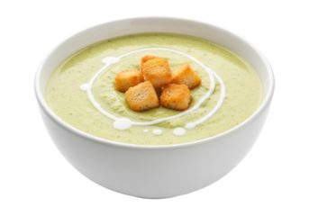 Isolated bowl of green creamy soup garnished with fresh croutons for mealtime appetizer