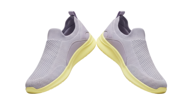 Isolated pair of casual women's slip-on shoes in mauve with yellow soles for everyday wear