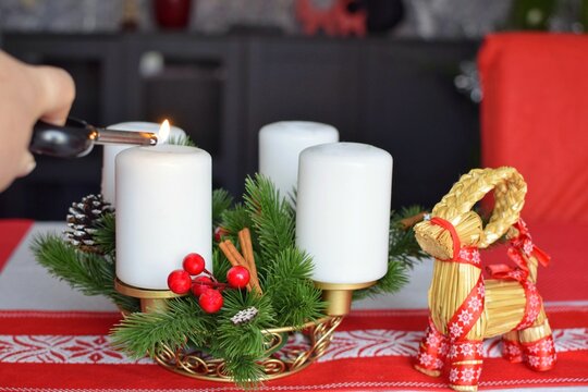 First Advent. The first candle of four is lit. Tradition before Christmas. - Powered by Adobe