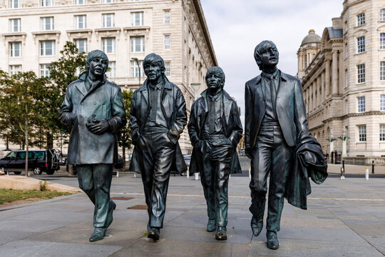 Liverpool, England - 10.08.2025: Statues of The Beatles on Liverpool waterfront