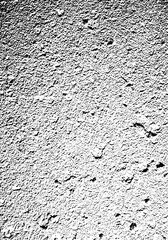 Gritty Stucco Texture Background Overlay. Abstract Rough Cement Surface in High Contrast Black and White Monochrome