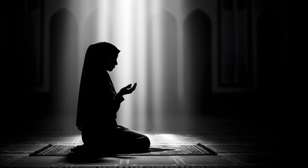 Silhouette of Muslim woman praying on a mat with hands open, bathed in spiritual light within a mosque.