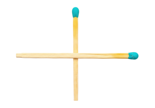 Isolated Cross made of two Matches with colorful Tips, Close up and top View, Bright Light