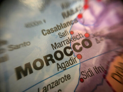 Warsaw, Poland - November 28, 2025: Close-up view of a map highlighting Morocco, showcasing the cities of Marrakech and Agadir, illustrating geographical location.