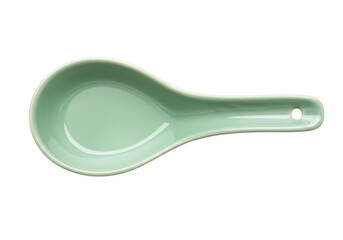 Isolated light green ceramic soup spoon for Chinese Japanese cuisine, kitchenware on a table