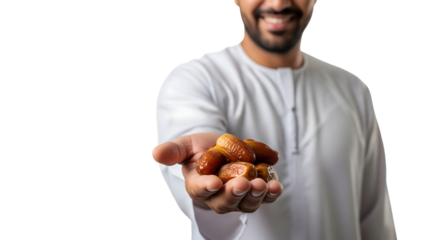 Close-up shot of a person offering dates in his palm with a friendly smile, showcasing hospitality and tradition, isolated on transparent background