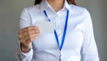 Business Card Display: a person gracefully displays a business card, symbolizing professional identity, networking, and opportunities, on the soft background.