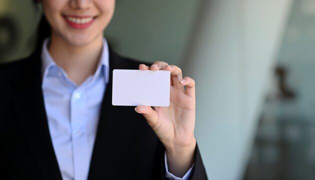 Business Card Presentation: A smiling individual in professional attire gracefully presents a pristine business card, exuding professionalism and approachability.