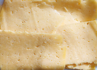 Close Up Of Sliced Egyptian Rumi Cheese With Crumbly Texture