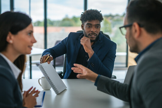 Multicultural business team collaborating during an office meeting