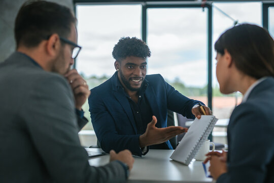 Multicultural business team collaborating during an office meeting
