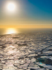 The "Sea of Plastic" Megastructure: Panoramic Aerial View of Vast Greenhouses Lining the Mediterranean Coast of Andalusia, Highlighting Global Food Production and Climate Change