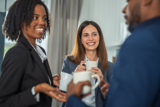 Diverse business colleagues enjoying coffee break conversation and networking