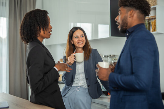 Diverse business colleagues enjoying coffee break conversation and networking