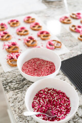 Homemade Gourmet: Delightful Pretzels Adorned with Pink Chocolate and Sprinkles