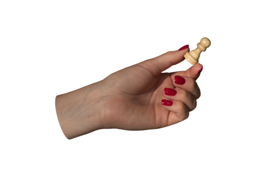 Hand of a woman holding chess pawn isolated