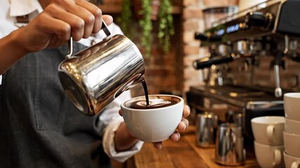 Barista holding cup of cappuccino with latte art near espresso machine - Powered by Adobe