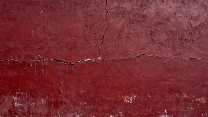 Obraz premium Weathered deep red painted surface shows distinct horizontal and vertical fissures