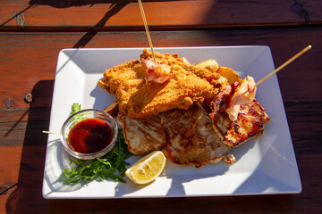 Grilled steak with schnitzel and wedges