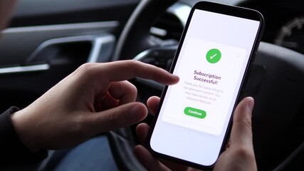 A user receives instant confirmation of his premium subscription upgrade while in his vehicle. This scene demonstrates the ease of accessing exclusive content through mobile subscriptions, ideal for - Powered by Adobe