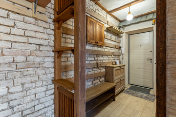 Rustic Wooden Hallway with Brick Wall and Warm Lighting