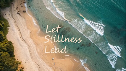 Aerial view of ocean waves washing over a sandy beach