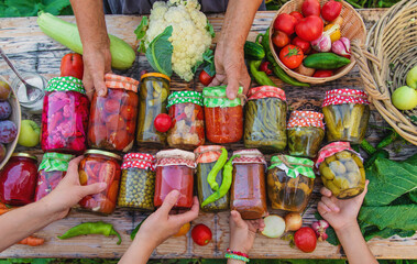 Jars with preserved vegetables for the winter. Selective focus.