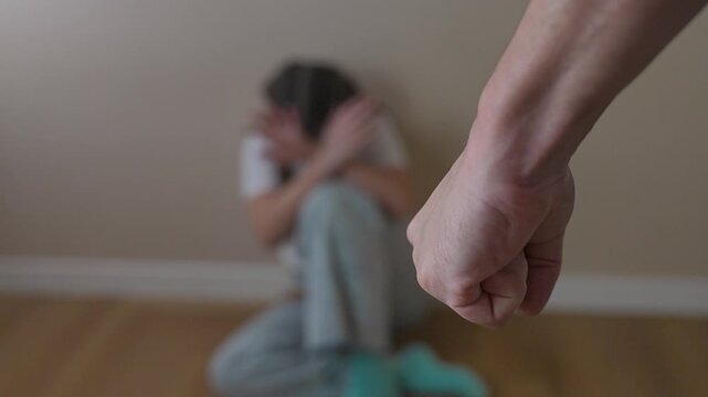 Girl hides in corner afraid of abuse. Trauma visible in body language. Fear dominates scene with child motionless. Girl sits silently in corner. Trauma, abuse, fear, girl. Trauma, abuse, fear, girl.