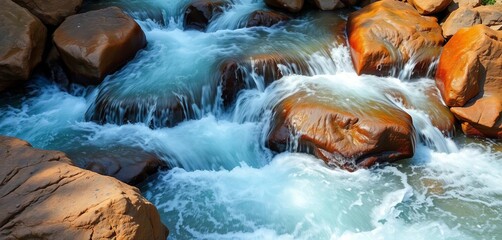 Water cascading over rocks, creating whitewater rapids,  rushing water,  flowing water