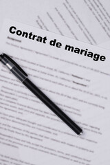 Contrat de mariage in French or Marriage contract, Marital Settlement Separation Divorce Agreement paper document, symbolizing divorce, prenuptial contract, prenup, breakup for France.