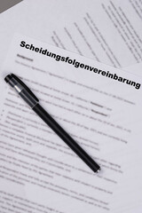 Scheidungsfolgenvereinbarung in German and Dutch, or Marital Settlement Separation Agreement paper document with wedding rings, symbolizing divorce, prenuptial contract, prenup, breakup for Germany