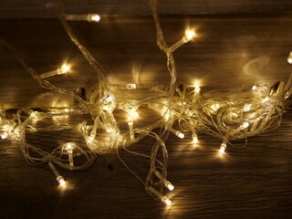 Warm Glow of Twinkling Fairy Lights on a Wooden Surface at Night