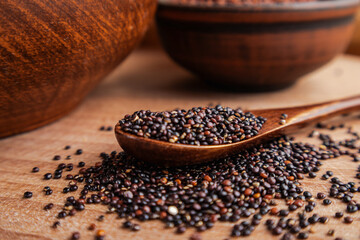 Healthy Black Quinoa Grains on Rustic Wooden Surface