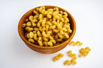 Dry Cavatappi Pasta in a Wooden Bowl on White Background