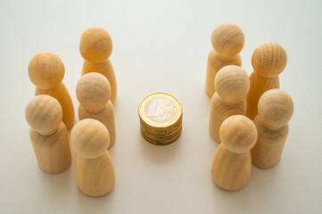 Two groups, depicted with wooden pawns, strategically analyze the distribution and impact of...