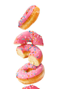 Creative concept of donuts on the white background. Desserts, bakery pastries.