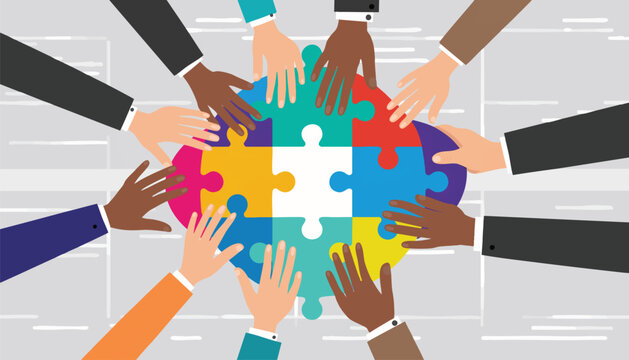 Flat lay of diverse hands placing puzzle pieces on a table with a light gray background, conveying unity and collaboration.