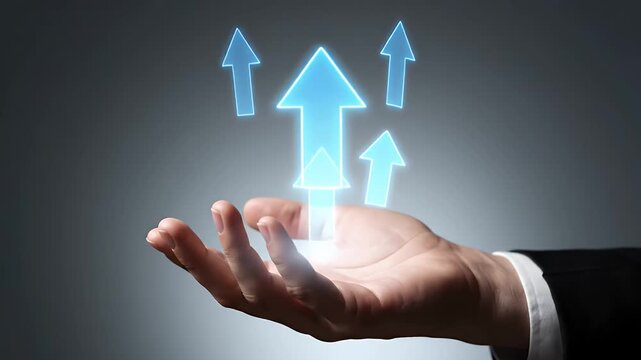 Hand Presenting Glowing Blue Arrow Pointing Upward on Gradient Gray Background in Studio with Suit Coat Sleeve Indicating Positive Growth and Direction