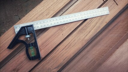Combination Square on Wooden Planks, carpenter tools on wood
