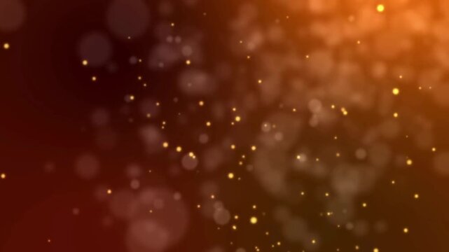 A warm orange background with bokeh and small glowing particles floating in the atmosphere effect