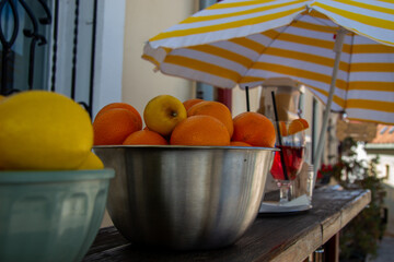 Fresh citrus fruit arranged in front of a restaurant door