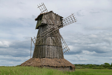 Old wooden mill close-up on a cloudy June day. Loskovskoye tract. Pskov region, Russia