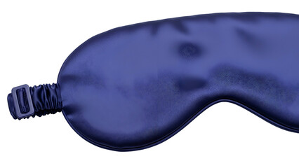 A close-up of a blue silk eye mask, lying on a dark background