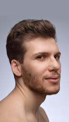 Obraz premium Man smiling slightly with nose bandage during early recovery. Concept of postoperative communication, clinic marketing, healing-stage documentation, and patient care visuals.