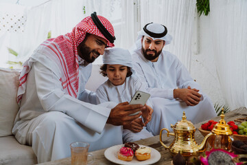Arab family bonding, father and son relaxing
