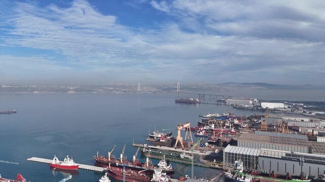 Stunning footage of the Osman Gazi Bridge spanning over the sea, capturing its impressive suspension-bridge structure and the surrounding coastal landscape of Yalova. A powerful symbol of modern engin